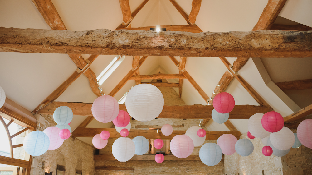 Pink and blue paper lanterns create a fabulous feature in Oxleaze Barn